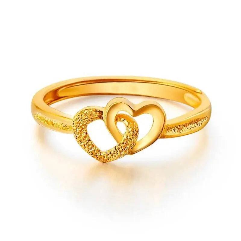Gold plated ring featuring two interlocking textured heart charms.