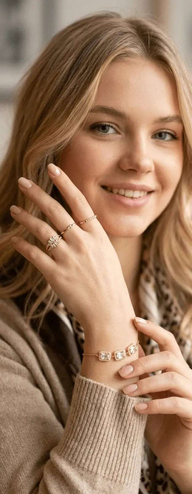 Woman wearing elegant gold rings and a gemstone bracelet