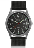 Black nylon strap watch by HAFIZ AND CO featuring an analog dial and classic design.