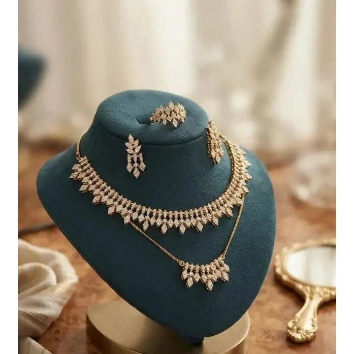 HAFIZ AND CO jewelry set featuring matching necklace and earrings with intricate design and sparkling gemstones.