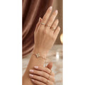 Gold HAFIZ AND CO butterfly charm adjustable bangle bracelet with delicate butterfly details and sleek design.