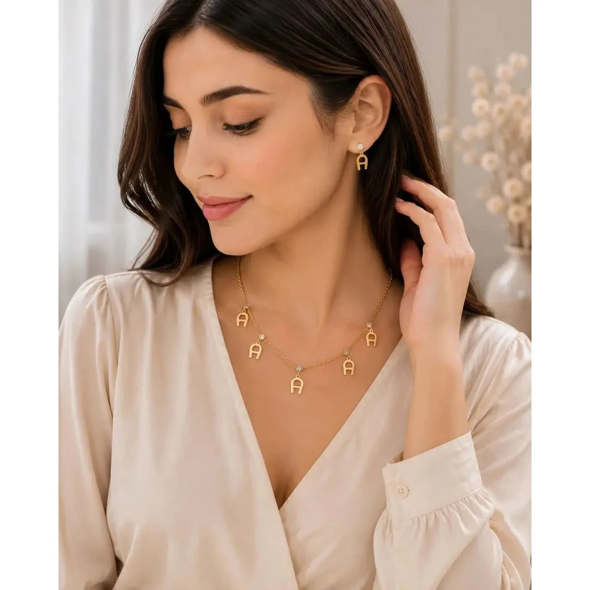 Gold necklace from HAFIZ AND CO Elegant Gold Set, featuring intricate design and a polished finish, displayed on a neutral background.