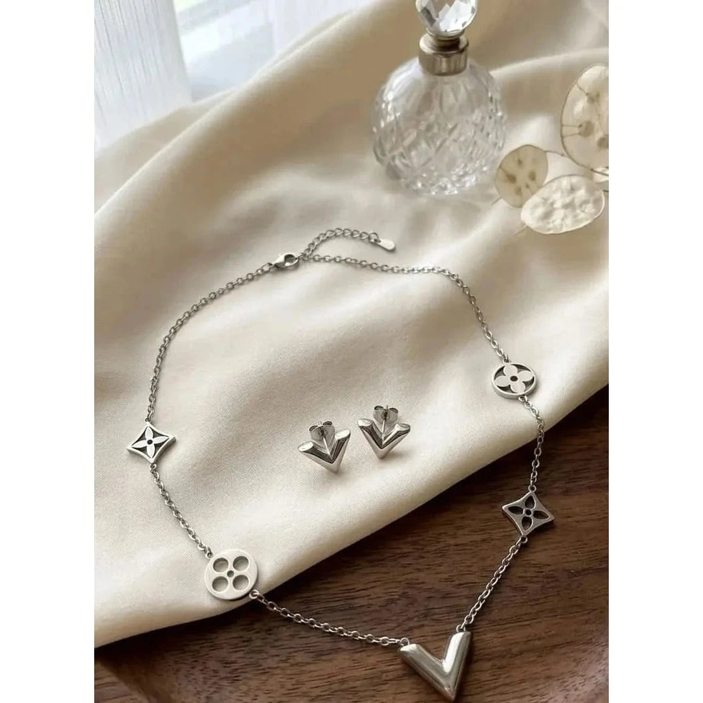 Elegant V-shaped necklace from HAFIZ AND CO Elegant V Jewelry Set, featuring intricate design and polished metal finish.