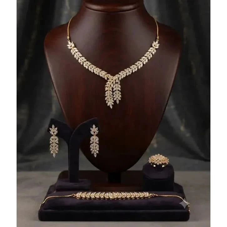 HAFIZ AND CO Golden Laurel jewelry set featuring matching necklace, earrings, and bracelet with intricate gold design.