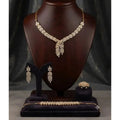 HAFIZ AND CO Golden Laurel jewelry set featuring matching necklace, earrings, and bracelet with intricate gold design.