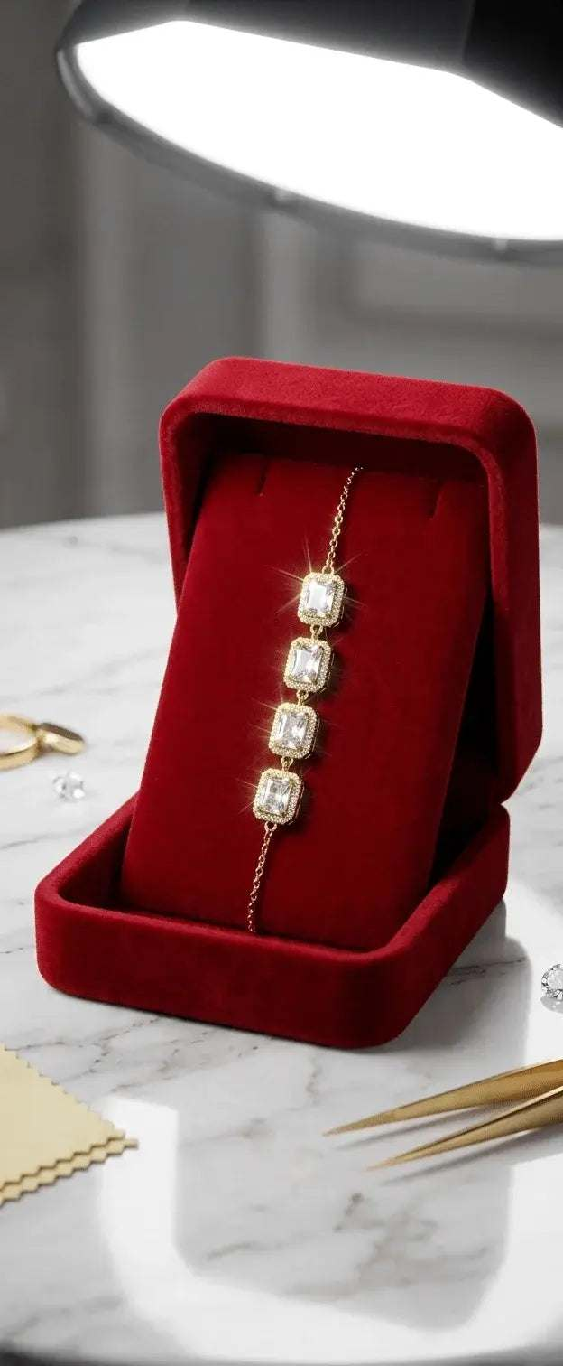 Elegant gold bracelet with four rectangular cubic zirconia stones in a red velvet box