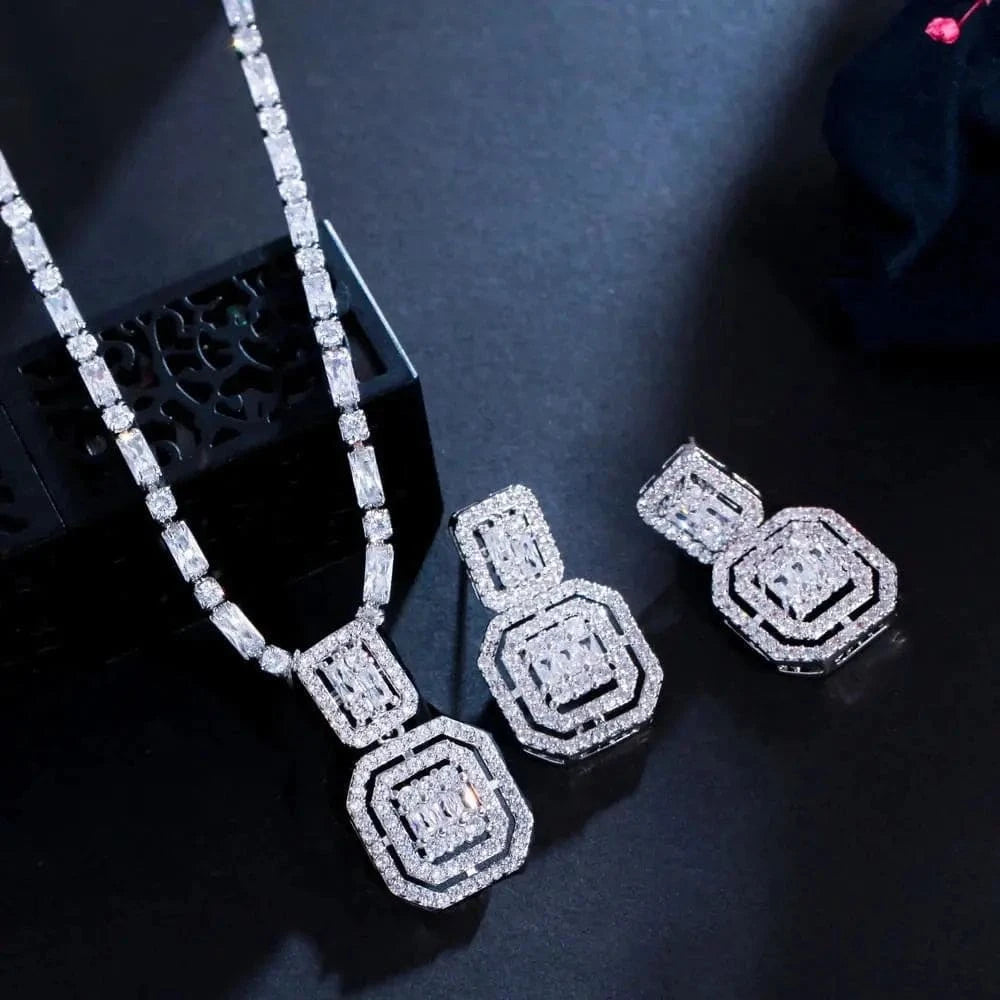 HAFIZ AND CO luxury bridal jewelry set featuring intricate necklace, earrings, and bracelet with sparkling gemstones and elegant design.