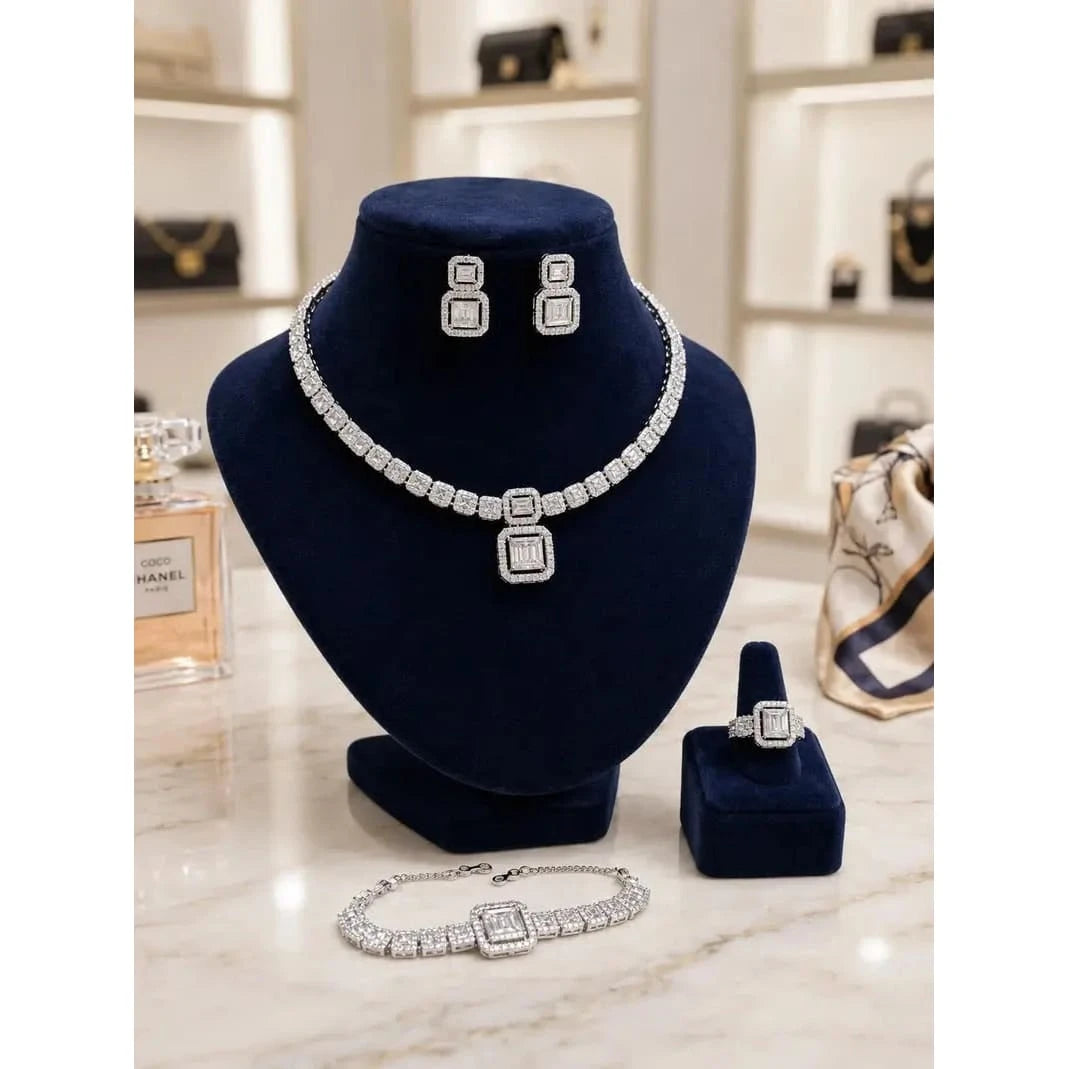 Elegant HAFIZ AND CO luxury bridal jewelry set featuring a necklace, earrings, and matching accessories for a wedding ensemble.