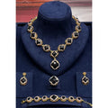 Elegant vintage jewelry set by HAFIZ AND CO featuring intricate designs and matching necklace and earrings.