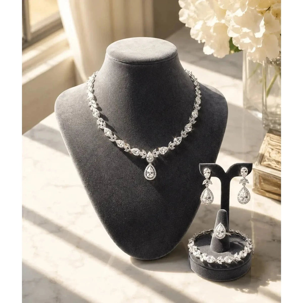 HAFIZ AND CO premium jewelry set featuring matching necklace, earrings, and bracelet with intricate design and sparkling embellishments.