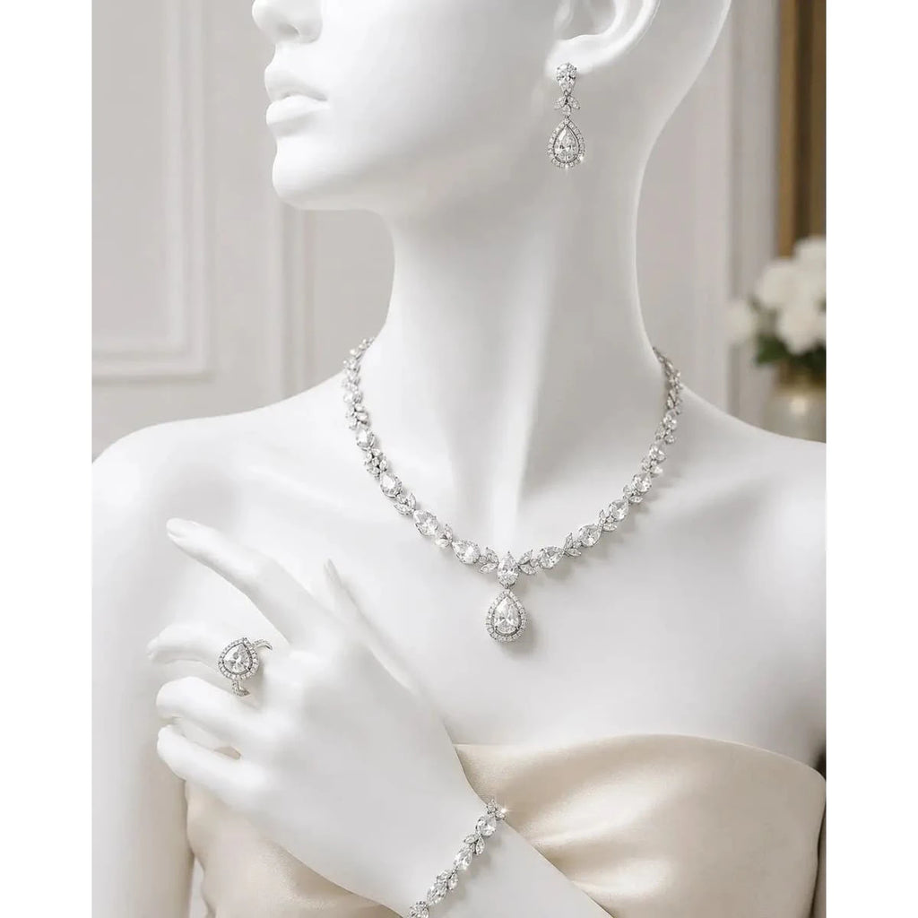 HAFIZ AND CO premium jewelry set featuring elegant necklace, earrings, and bracelet with intricate gold and gemstone detailing.