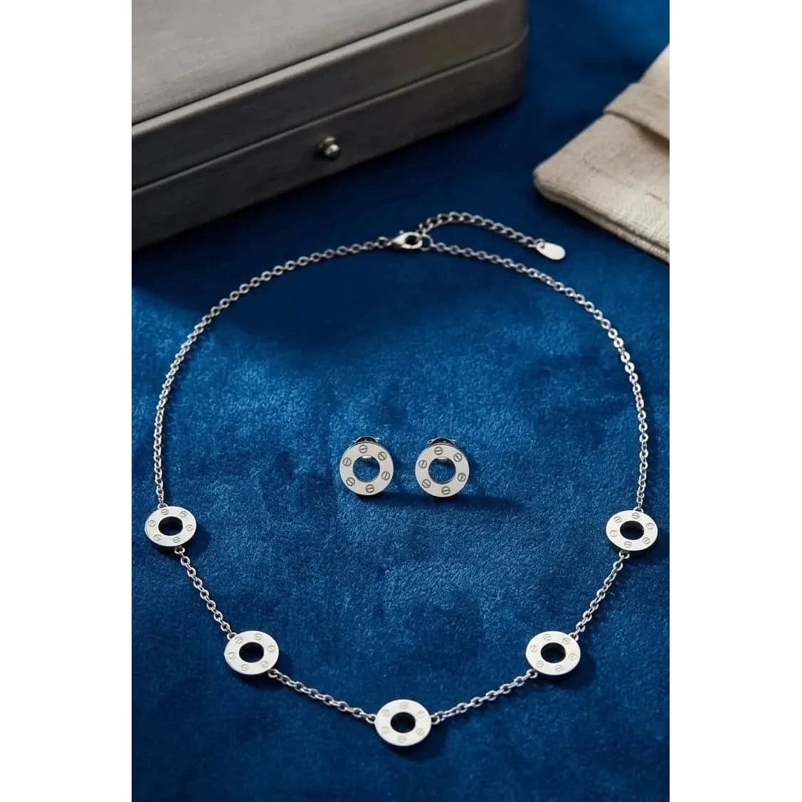 HAFIZ AND CO screw motif necklace from jewelry set featuring metallic chain with screw design, stylish accessory for casual or formal wear.