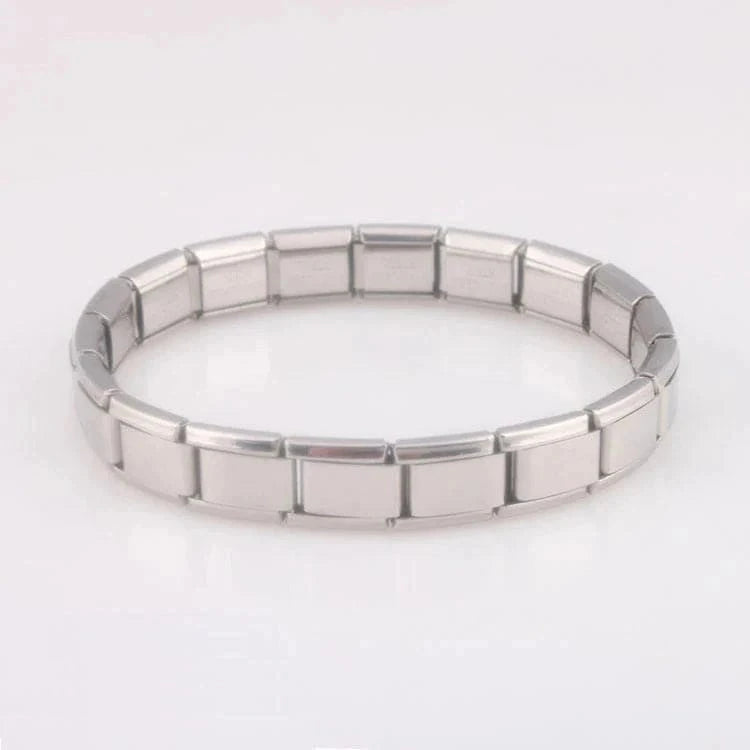 Silver HAFIZ AND CO stretch link bangle with sleek, interconnected design, showcasing a stylish and flexible jewelry accessory.