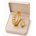 Set of HAFIZ AND CO studded gold bangles featuring a stylish design with embedded studs, perfect for elegant jewelry collection.