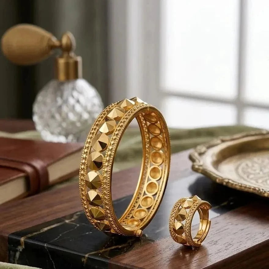 Set of gold-toned  studded bangles featuring multiple thin bangles with metallic studs, perfect for stylish wrist accessories.