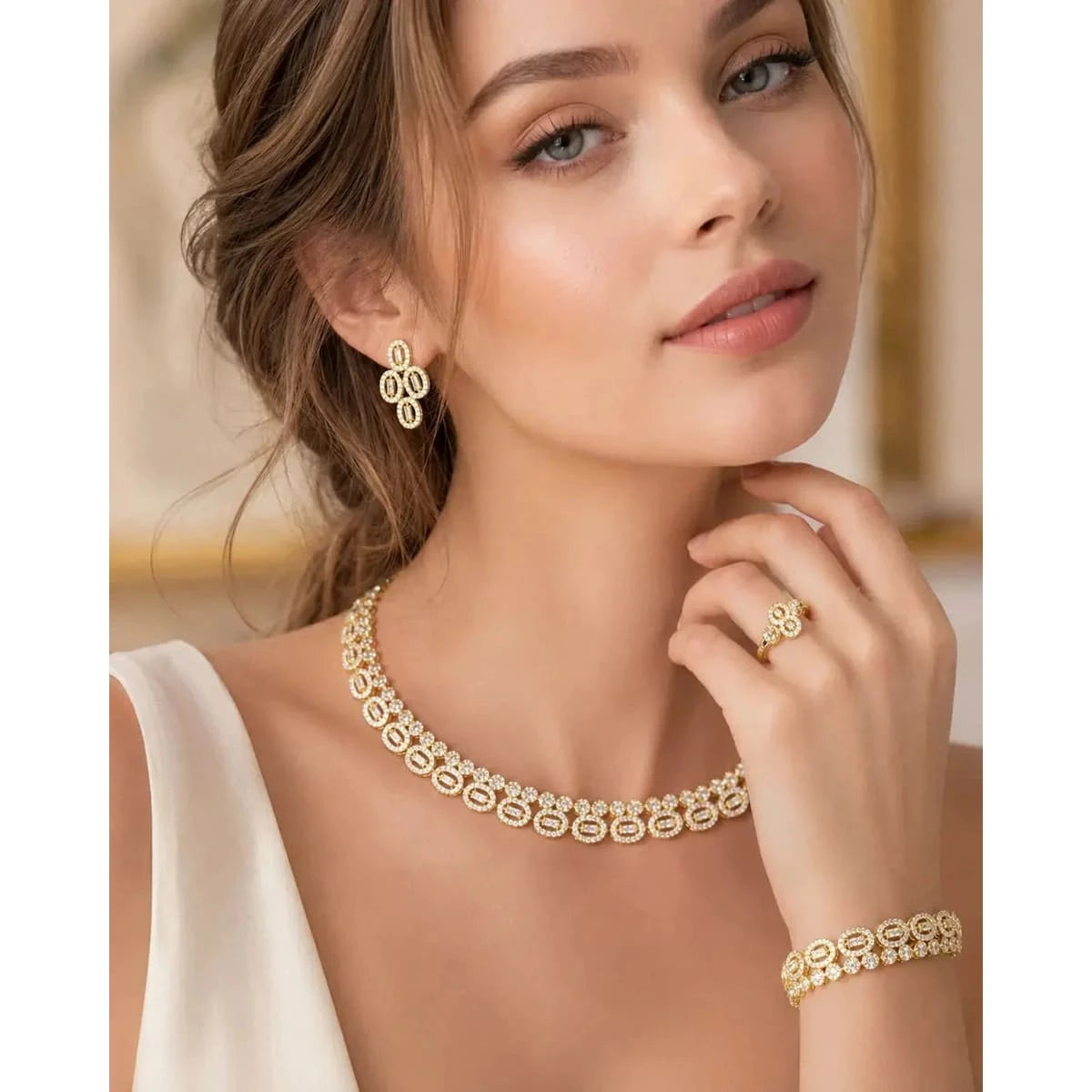 ElegantHAFIZ AND CO women's jewelry set featuring a necklace, earrings, and bracelet with intricate design and sparkling gemstones.