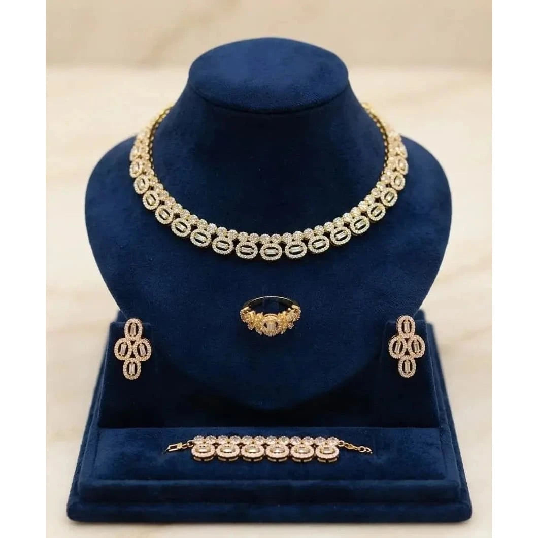 Elegant HAFIZ AND CO jewelry set for women featuring a matching necklace, earrings, and bracelet with intricate design.