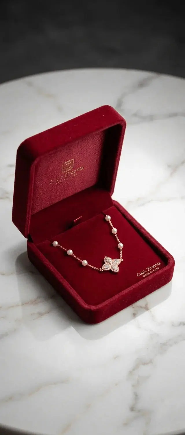 Gold HAFIZ AND CO butterfly charm adjustable bangle bracelet with delicate butterfly detail and sleek design.