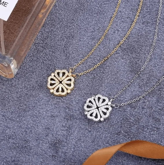 Gold Flower Four Leaf Necklace by HAFIZ AND CO, featuring a delicate floral pendant on a fine chain.