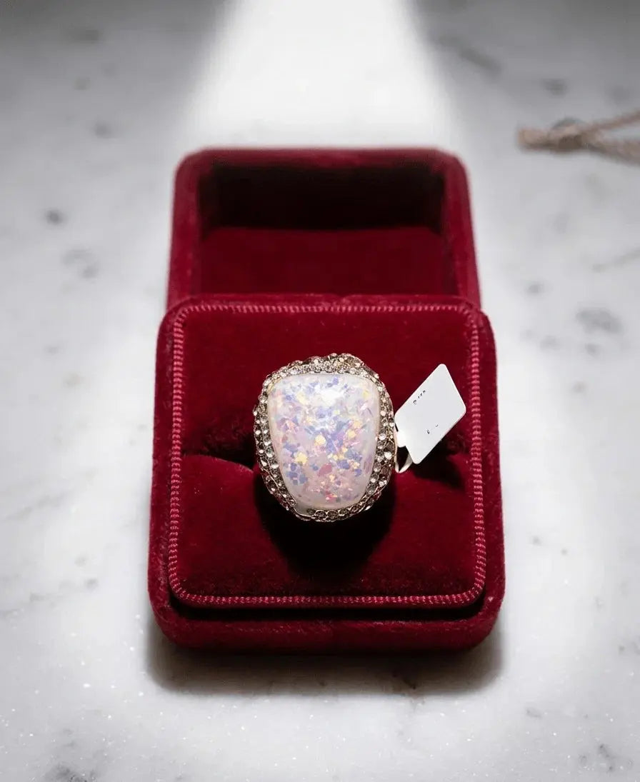 HAFIZ AND CO opal statement ring featuring a large, vibrant opal gemstone set in a stylish silver band.