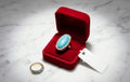 Turquoise crystal ring by HAFIZ AND CO featuring a polished turquoise stone set in a sleek silver band.