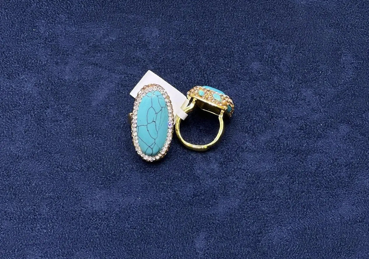 Turquoise crystal ring by HAFIZ AND CO featuring a silver band and a prominent turquoise gemstone centerpiece.