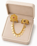 Gold filigree chain ring by HAFIZ AND CO showing intricate filigree detailing and delicate chain design on a plain background.