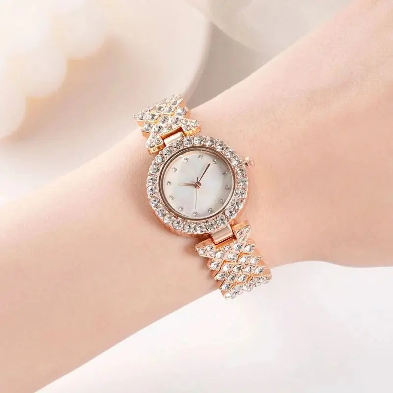 Gold women's Zambeel quartz watch with diamond accents and alloy band, showcasing an elegant and stylish timepiece.